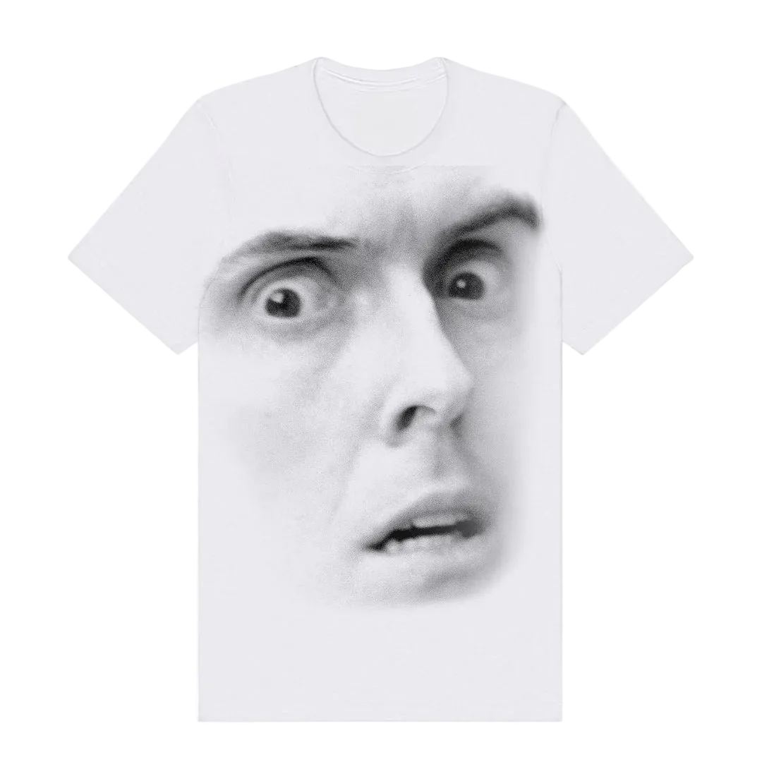 White t-shirt with a printed face design on a white background