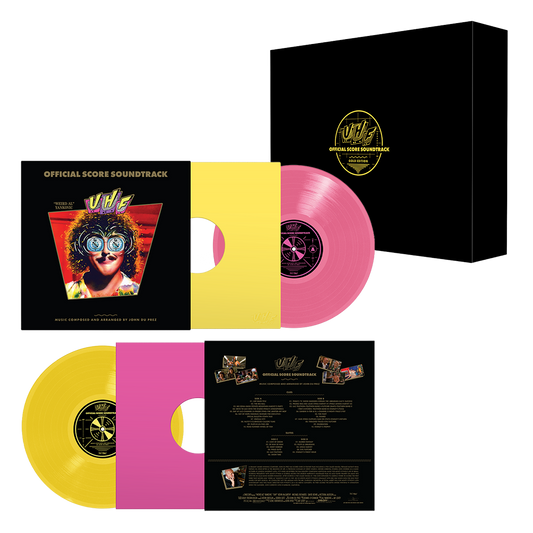 Official Score Soundtrack vinyl record package shown on a white background, including a black outer box with a gold circular logo, a black album cover with artwork, and two translucent vinyl records in yellow and pink, plus the inner track and back cover details.
