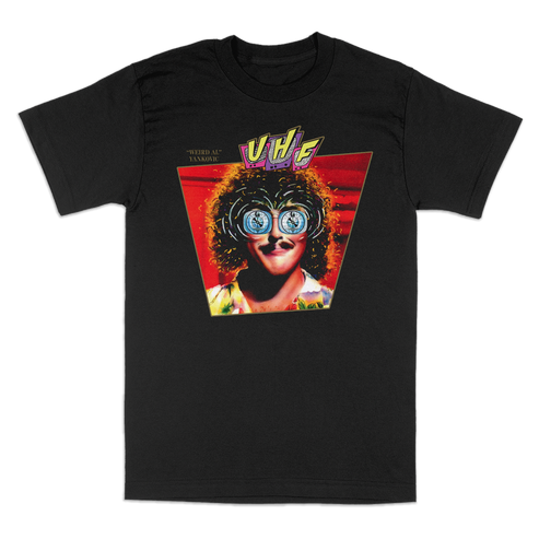 A black short-sleeve graphic t-shirt featuring "Weird Al" Yankovic with round glasses. The graphic shows a stylized portrait of a person with curly hair and blue-tinted glasses inside a red triangle, with the 'UHF' logo above.